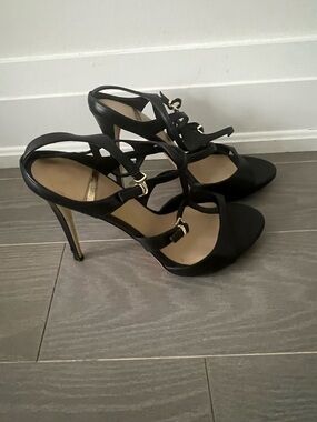 Marciano Black Strappy Stiletto Sandals with Gold Accents